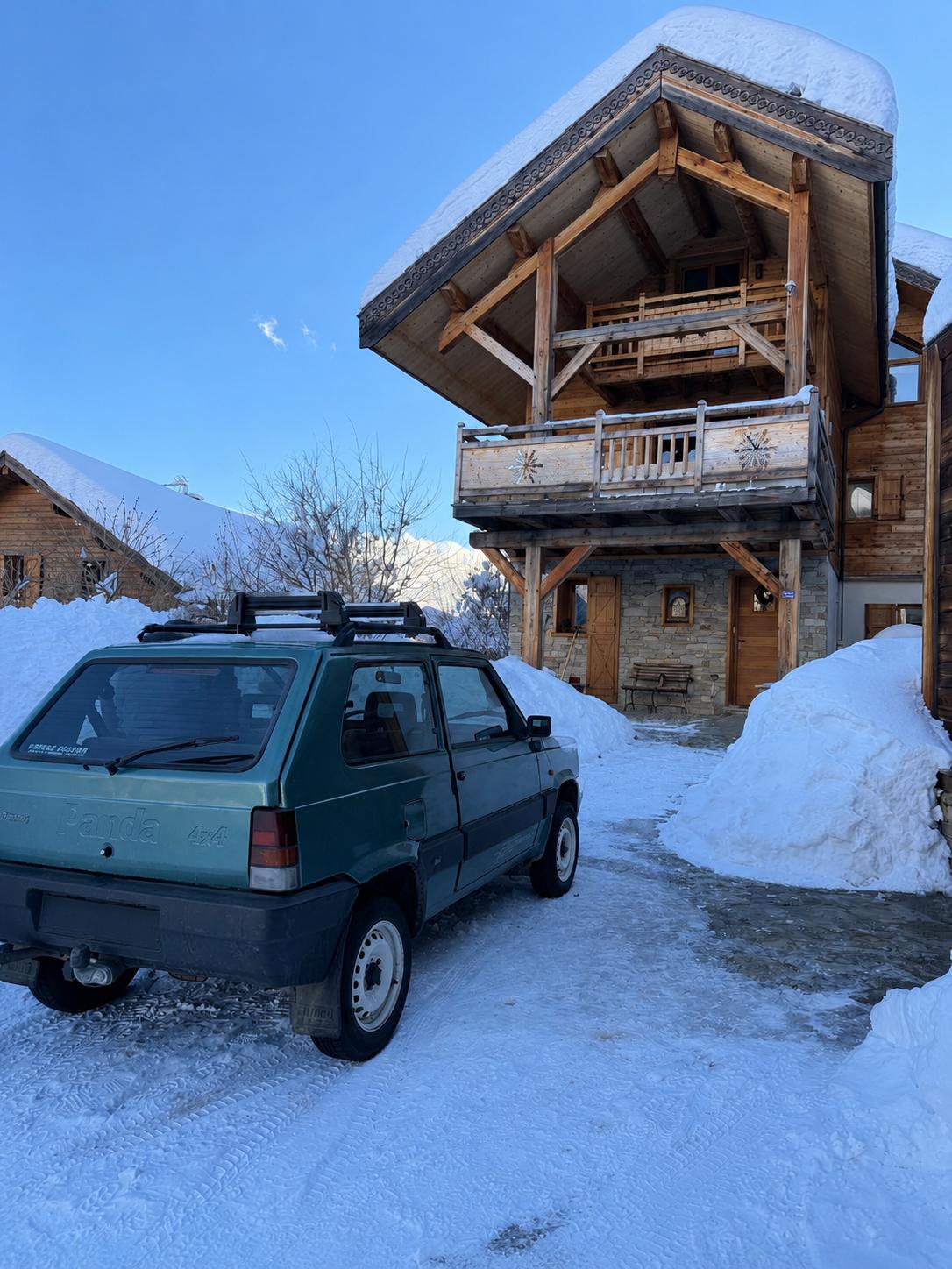 Les Virages chalet in winter with deep snow